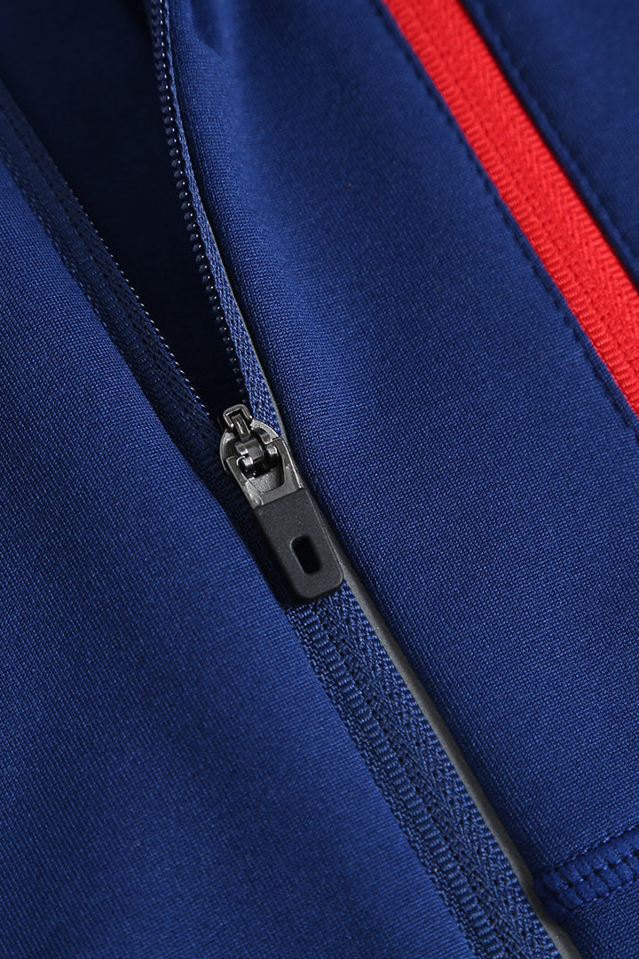Red zipped chest pocket on navy thermal running top